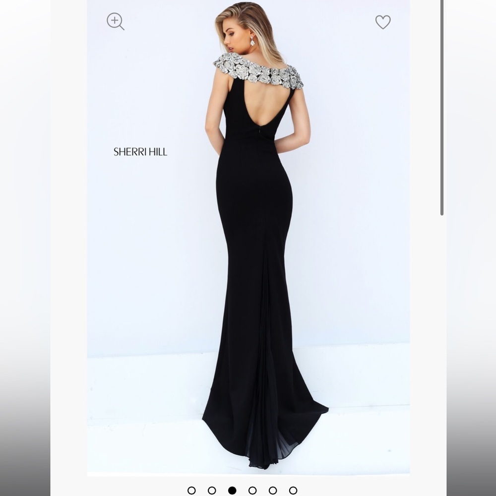 Sherri Hill size 6 black with silver floral cap sleeve 
Never worn
